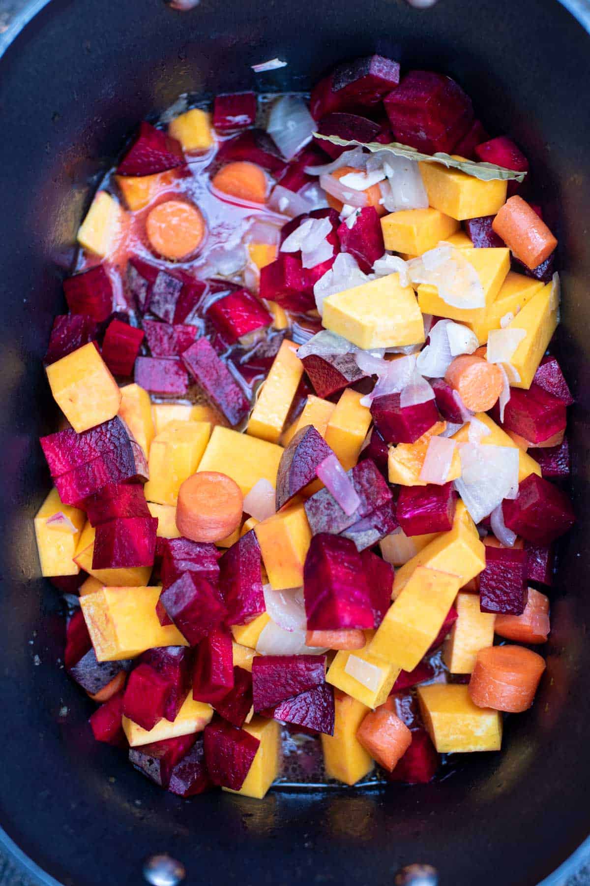 diced butternut squash, beets, and carrots in the slow cooker