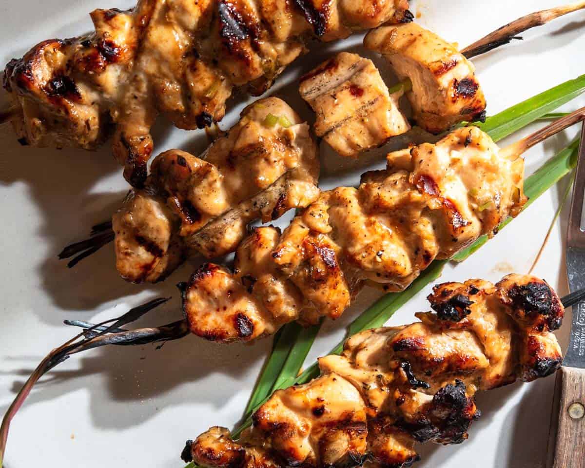 plated chicken skewers with tigernut butter sauce