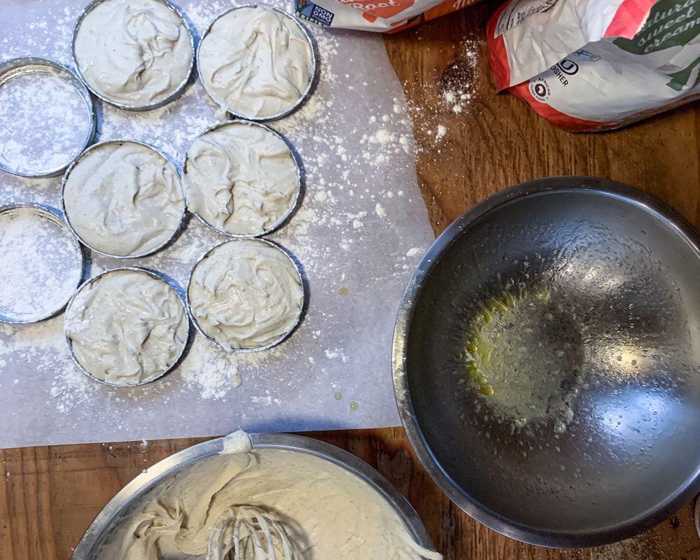 English muffin dough shaped using Mason Jar lid rings