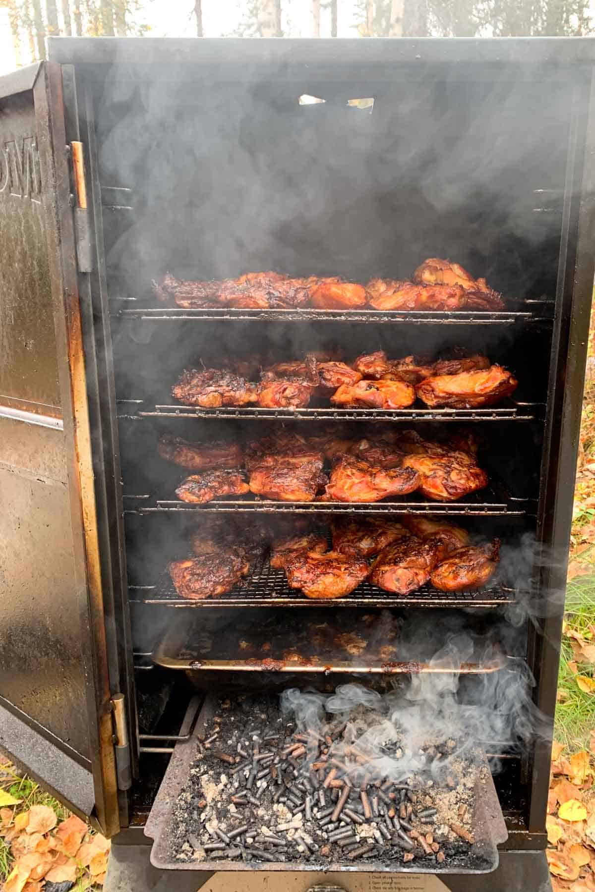 smoker with wood pellets and chicken thighs