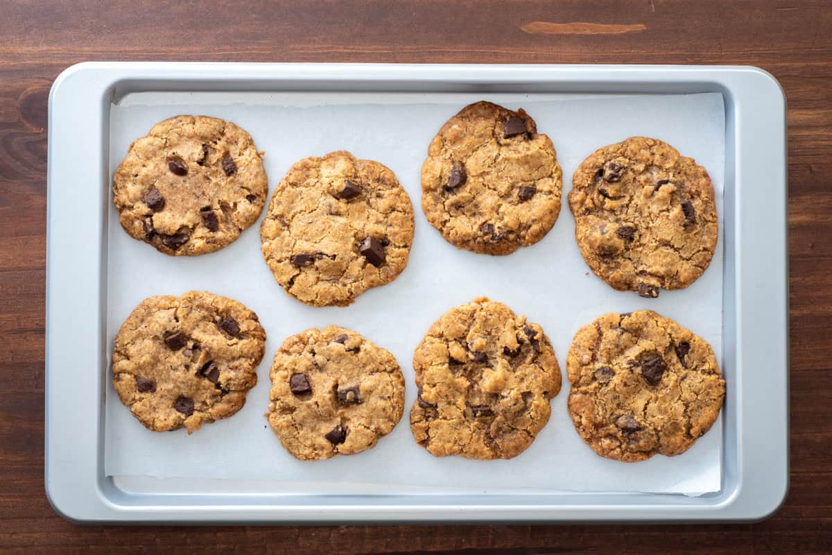 baked chocolate chip cookies on a baking sheet