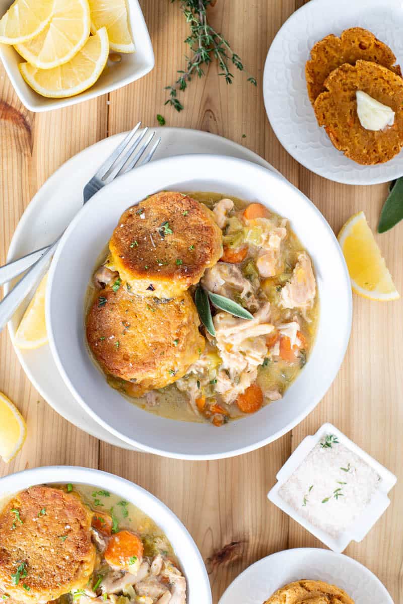 chicken pot pie in bowl sweet potato biscuits on top