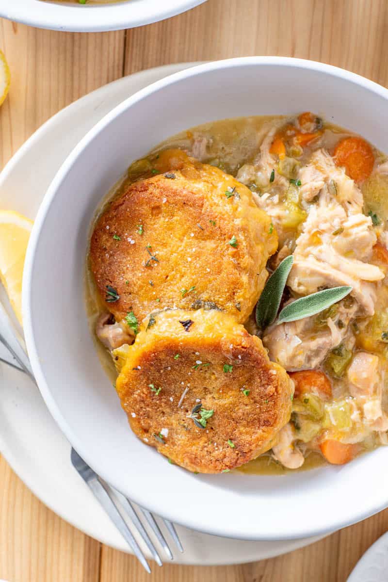 chicken pot pie with biscuits in a bowl