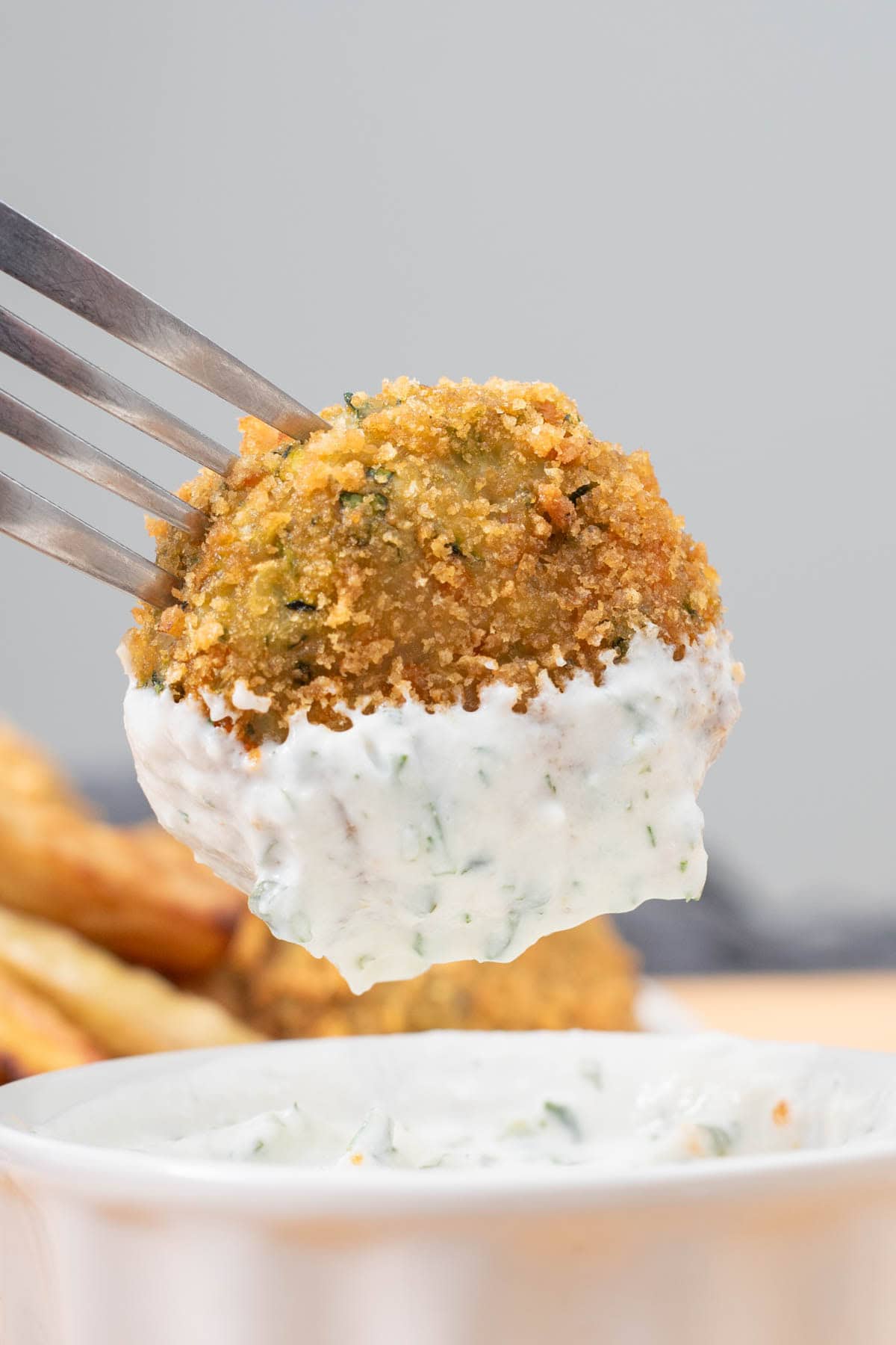 paleo chicken nugget crusted with pork rinds dipped into dairy-free ranch dressing