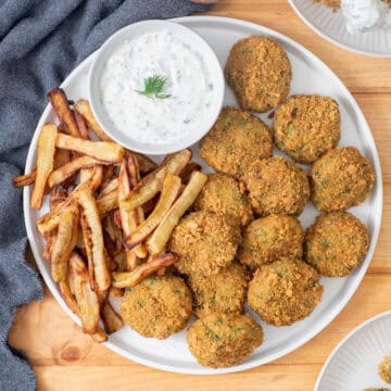 AIP chicken nuggets served with banana fries and dairy free ranch on plate