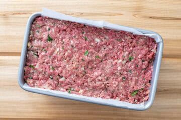 meatloaf mixture in parchment lined baking dish