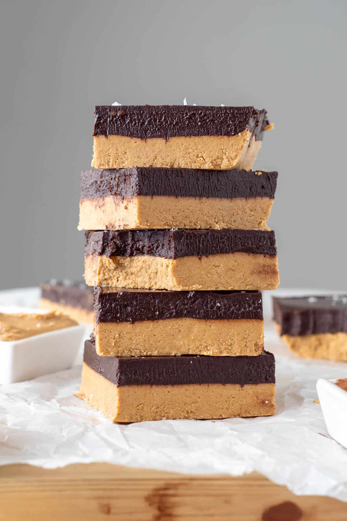 tigernut butter bars cut into squares and stacked tall with carob