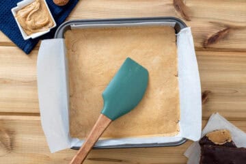 protein paste pressed into pan lined with parchment paper