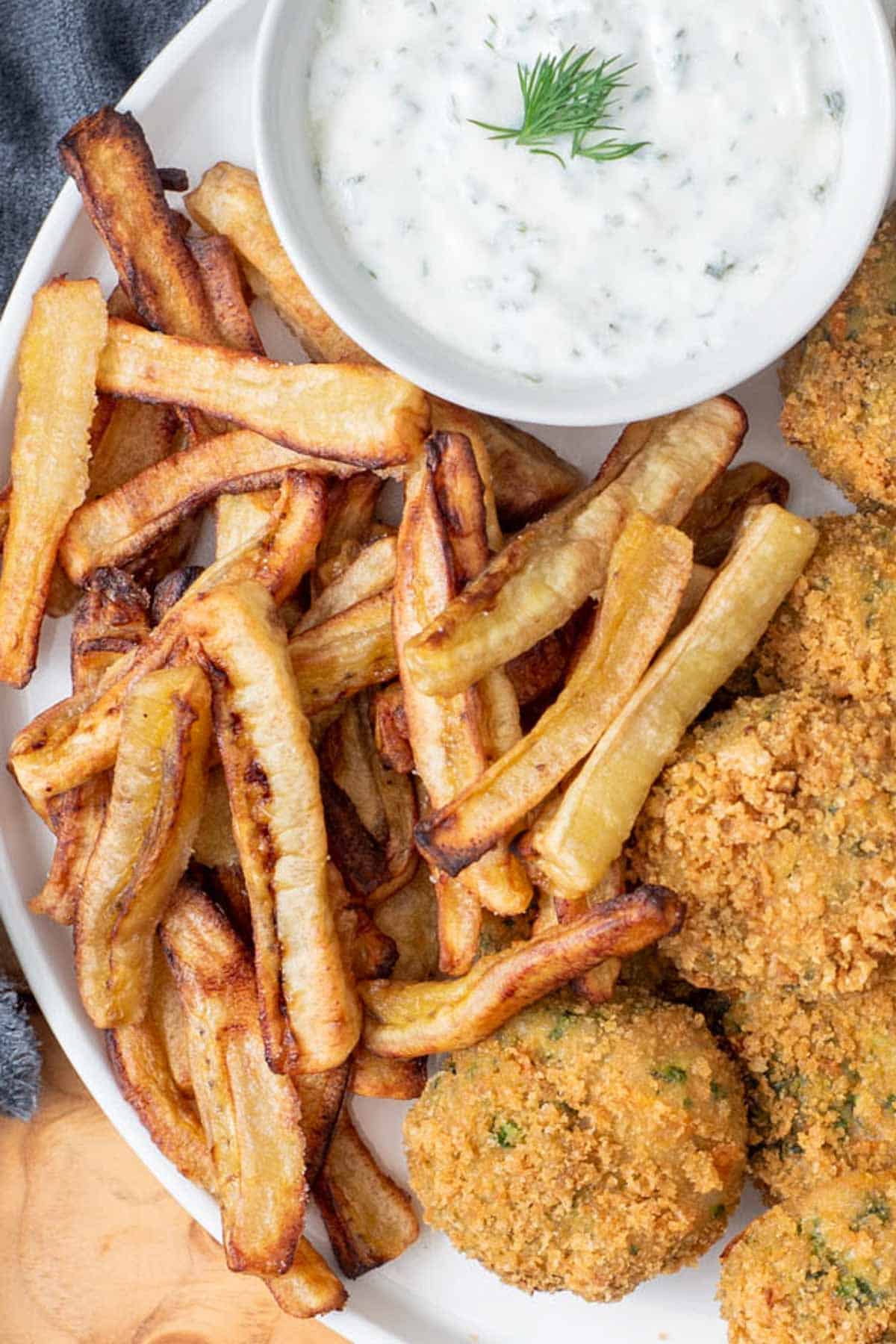 air-fried green banana fries on plate with chicken and ranch