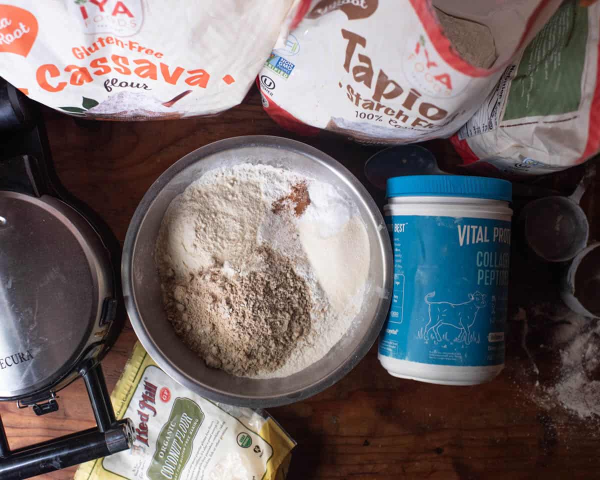 Cassava flour, tapioca flour, collagen peptides, coconut flour, salt, and cinnamon in mixing bowl