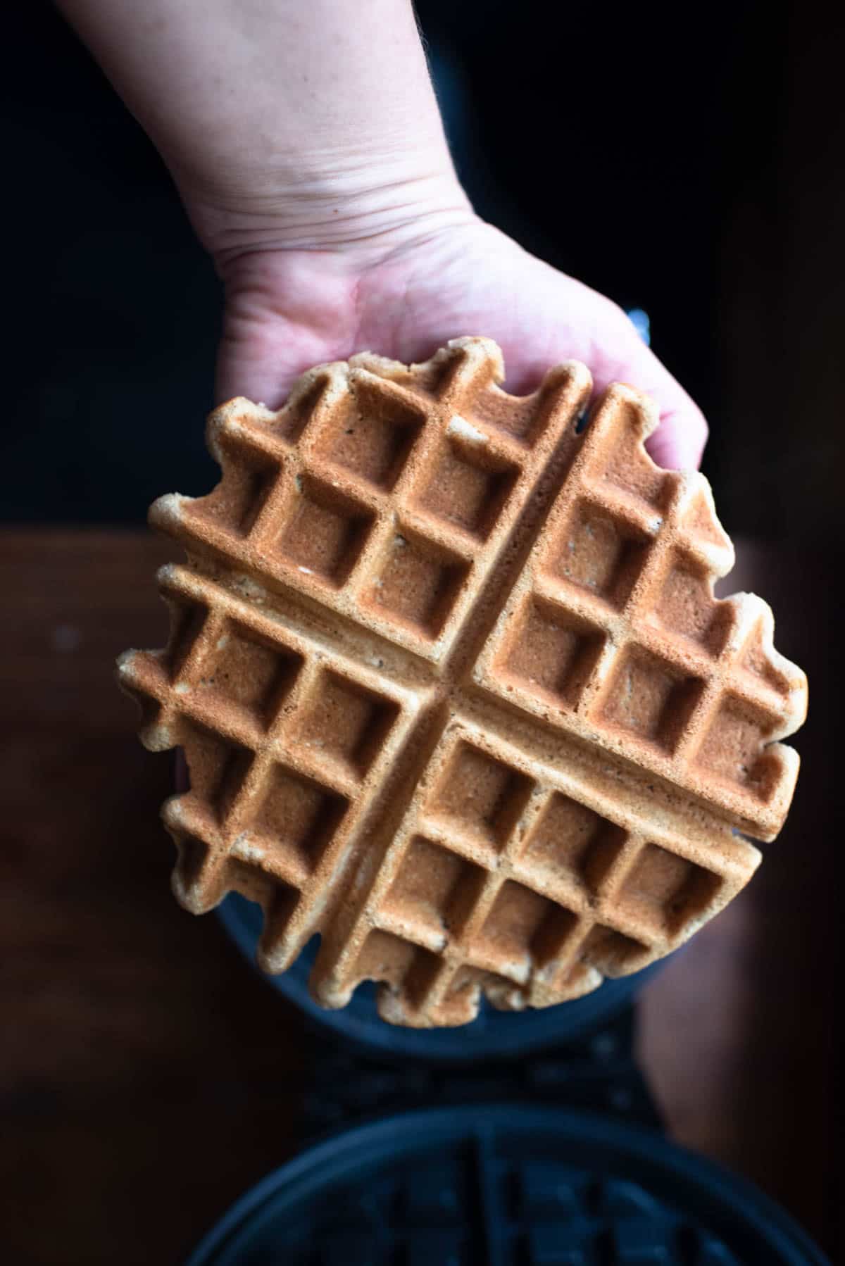 holding a cooked AIP waffle 
