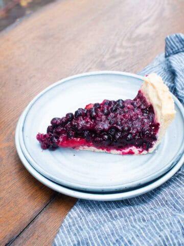 blueberry pie with strawberries on plate