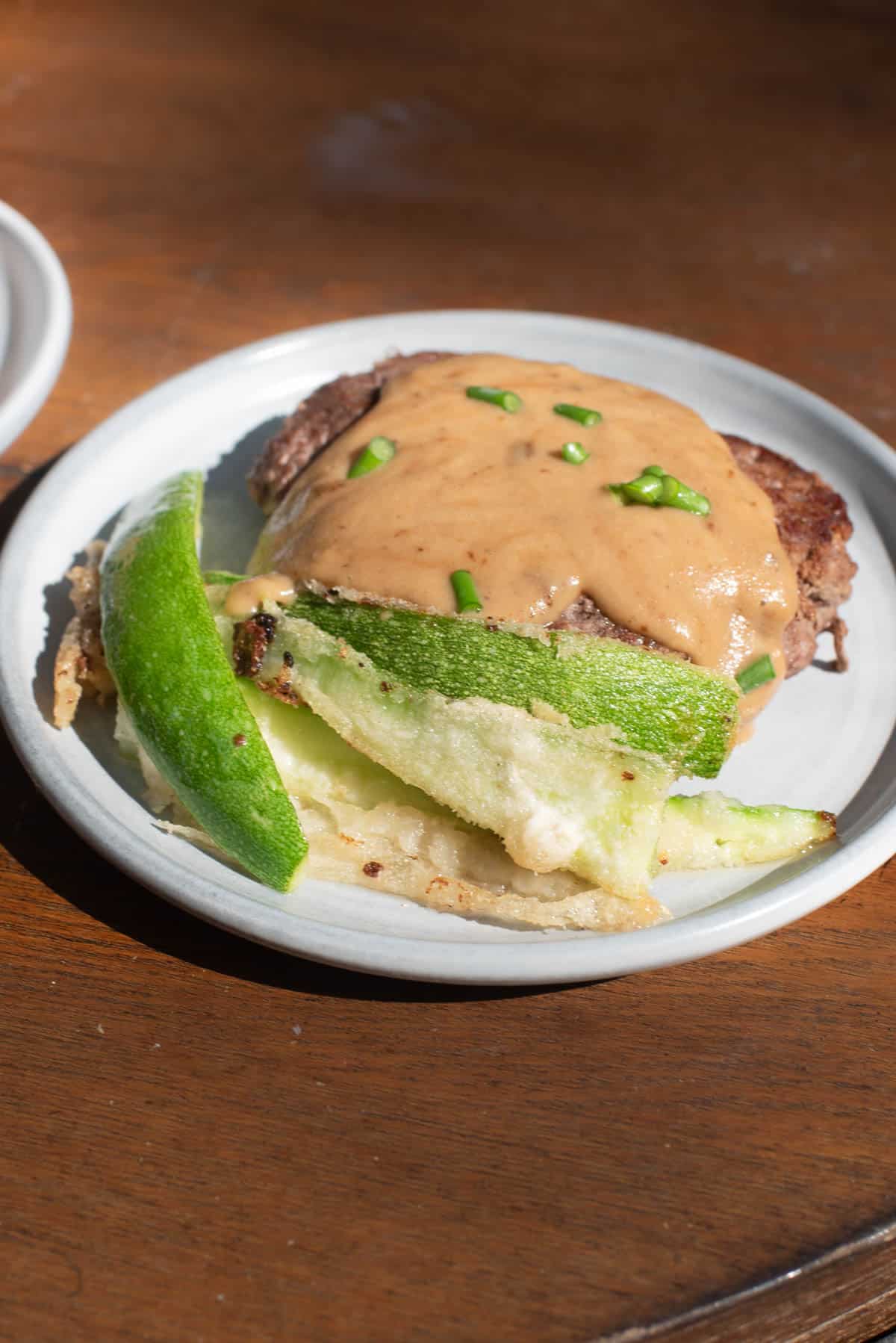 grass-fed beef and AIP umami sauce with zucchini fries