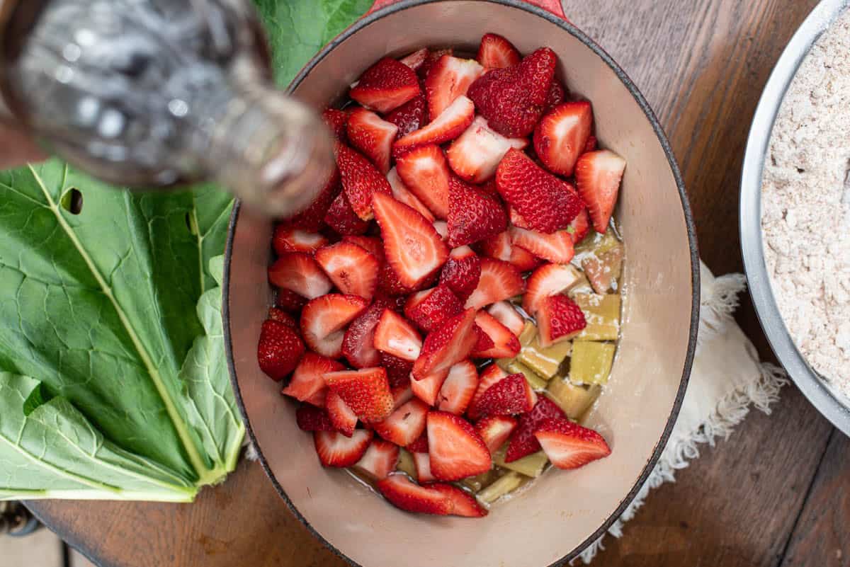 fresh strawberries and rhubarb in Dutch oven