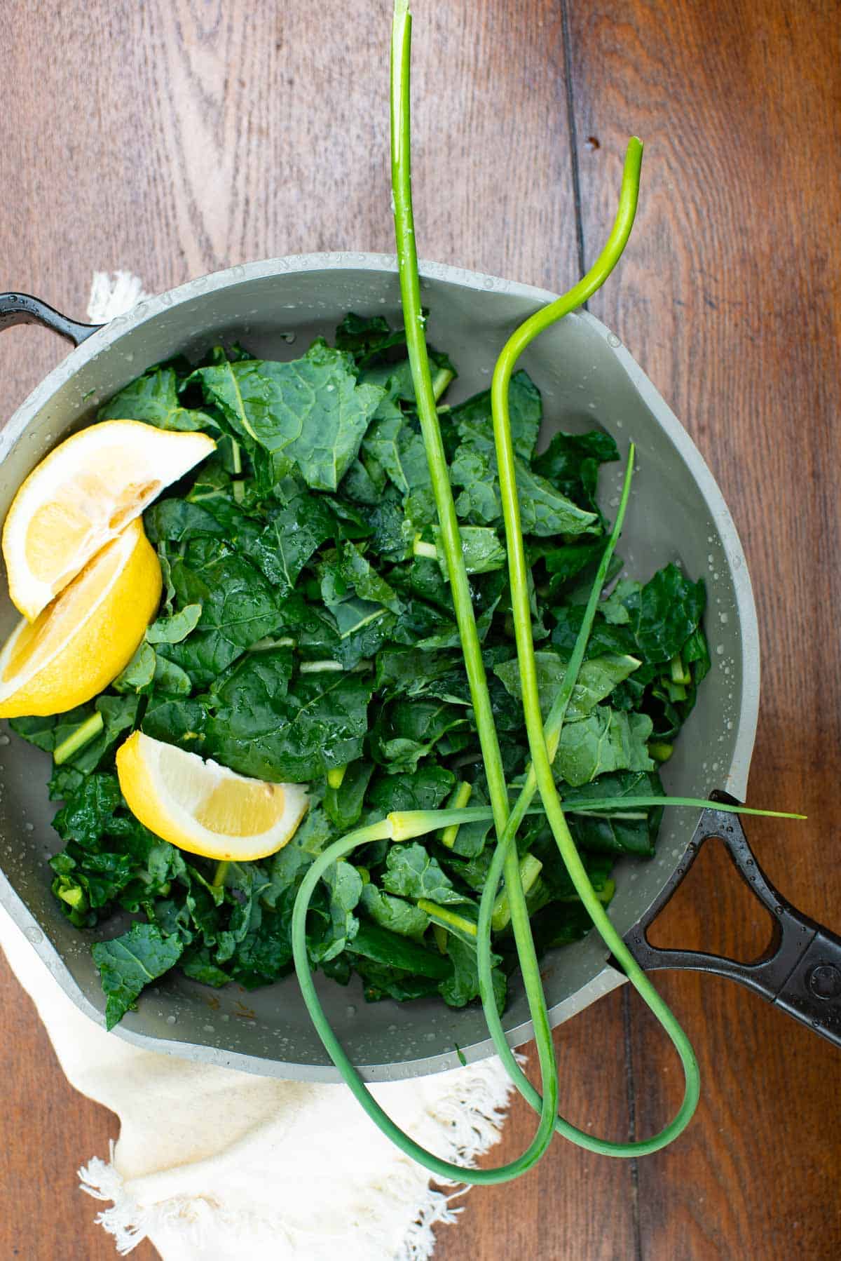 kale chopped, lemon and green garlic in skillet