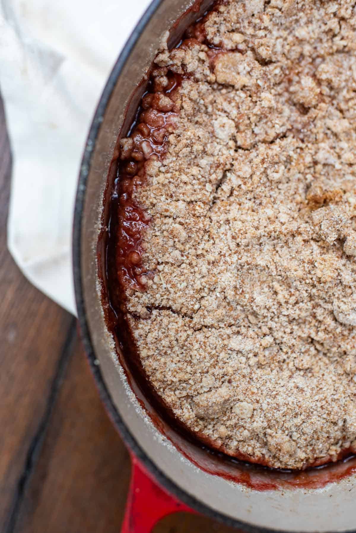 Strawberry-rhubarb crisp in Dutch oven bubbly filling